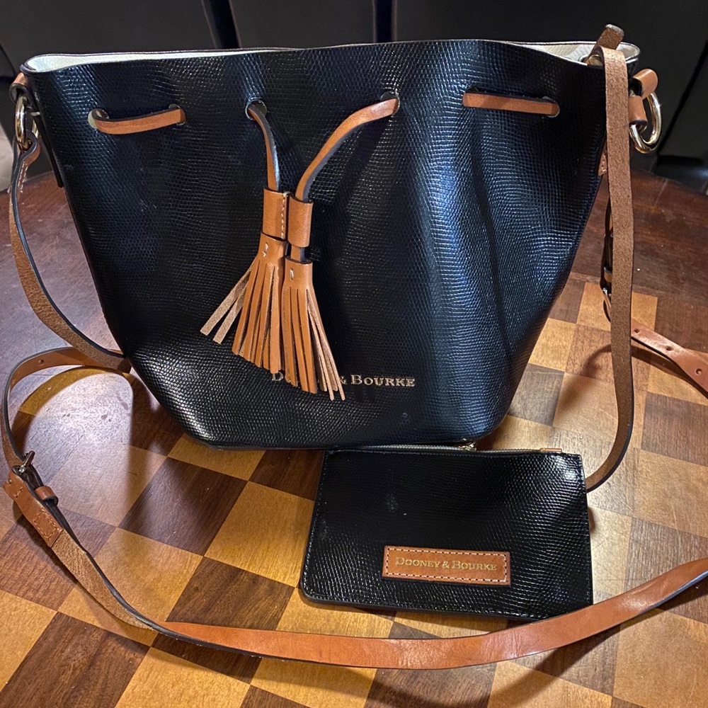Dooney and Bourke Drawstring Black Bucket Crossbody Bag.
